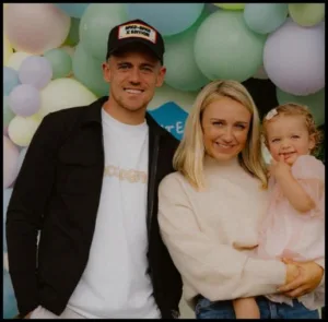 Sammie Szmodics with his wife and Daughter
