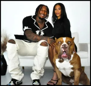 Trevis Gipson with Brisco Gipson and dog